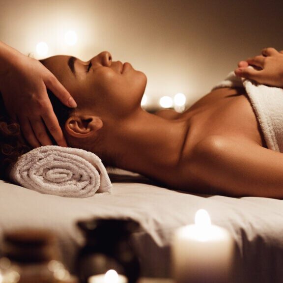 Spa woman. Girl having massage and enjoying aroma therapy in spa salon